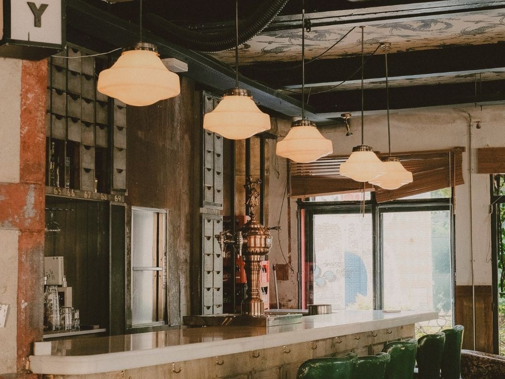 A workspace with pendant lights and a long counter